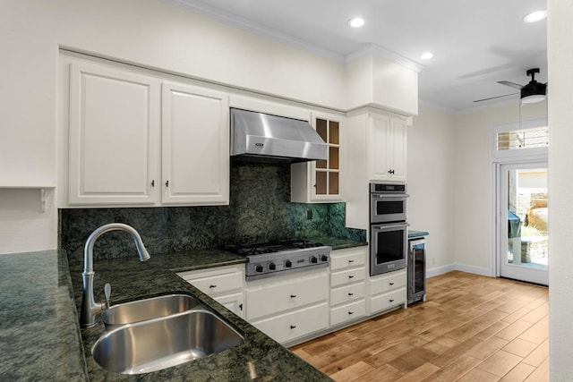 3647 Paseo Vista Famosa, Rancho Santa Fe, CA 92091 - kitchen featuring stainless steel appliances, ventilation hood, crown molding, decorative backsplash, and white cabinets