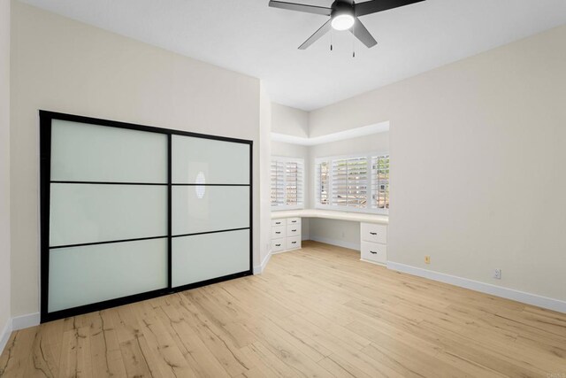 3647 Paseo Vista Famosa, Rancho Santa Fe, CA 92091 - unfurnished bedroom featuring built in study area, light wood-type flooring, and ceiling fan