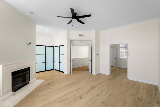 3647 Paseo Vista Famosa, Rancho Santa Fe, CA 92091 - unfurnished living room with ceiling fan, wood finished floors, a glass covered fireplace, and recessed lighting