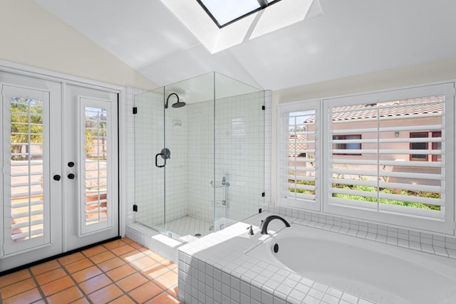 3647 Paseo Vista Famosa, Rancho Santa Fe, CA 92091 - bathroom with vaulted ceiling, a skylight, tile patterned floors, a stall shower, and a bath