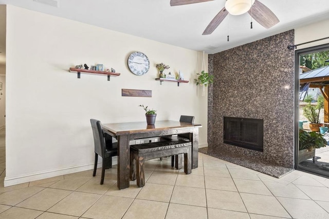 26267 Bellemore Dr, Ramona, CA 92065 - dining room featuring a ceiling fan, light tile patterned floors, and a fireplace