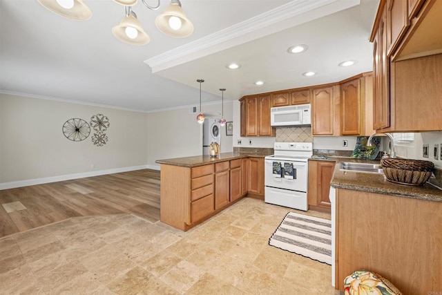 31916 Del Cielo Este Unit 38, Bonsall, CA 92003 - kitchen featuring white appliances, a peninsula, ornamental molding, recessed lighting, and brown cabinetry