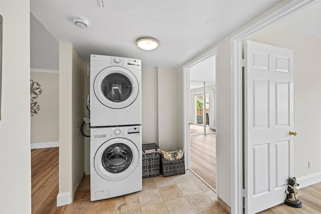 31916 Del Cielo Este Unit 38, Bonsall, CA 92003 - laundry room featuring stacked washer / drying machine and light wood-style floors