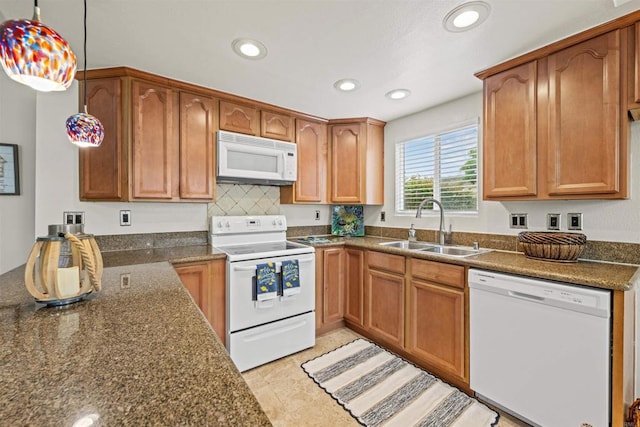31916 Del Cielo Este Unit 38, Bonsall, CA 92003 - kitchen with white appliances, recessed lighting, hanging light fixtures, a peninsula, and brown cabinetry