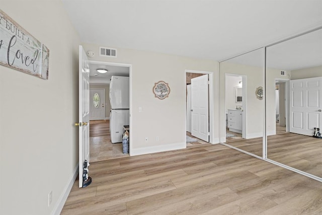 31916 Del Cielo Este Unit 38, Bonsall, CA 92003 - unfurnished bedroom featuring light wood-style flooring and connected bathroom