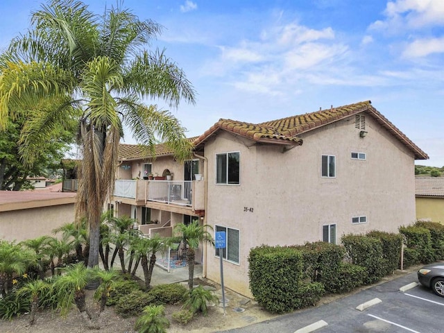 31916 Del Cielo Este Unit 38, Bonsall, CA 92003 - view of building exterior with uncovered parking