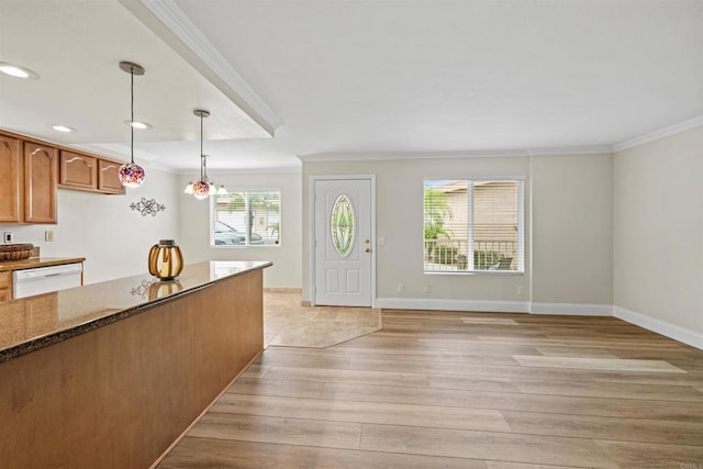 31916 Del Cielo Este Unit 38, Bonsall, CA 92003 - kitchen featuring dishwasher, ornamental molding, light wood-style flooring, decorative light fixtures, and dark stone countertops