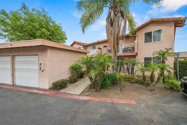 31916 Del Cielo Este Unit 38, Bonsall, CA 92003 - view of front of property featuring stucco siding and a balcony