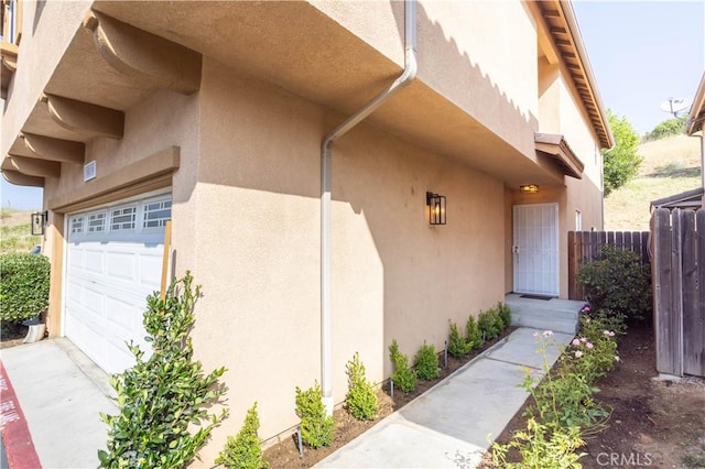 14114 Almetz Cir, Sylmar, CA 91342 - property entrance featuring stucco siding and an attached garage