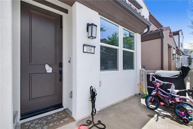3934 Lavine Way Unit 108, Corona, CA 92883 - property entrance featuring stucco siding
