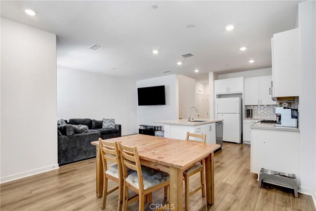 3934 Lavine Way Unit 108, Corona, CA 92883 - dining area with light wood-style flooring and recessed lighting