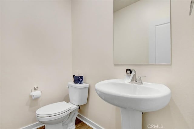 3934 Lavine Way Unit 108, Corona, CA 92883 - bathroom with baseboards and wood finished floors
