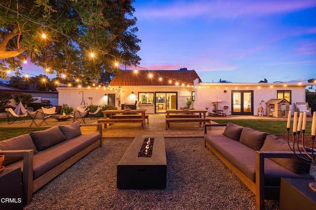 705 Alomar St, Ojai, CA 93023 - view of patio / terrace with french doors and an outdoor living space with a fire pit