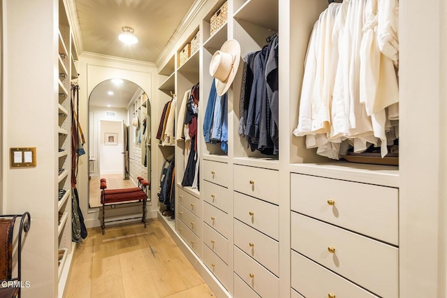 705 Alomar St, Ojai, CA 93023 - walk in closet with arched walkways and light wood-style flooring