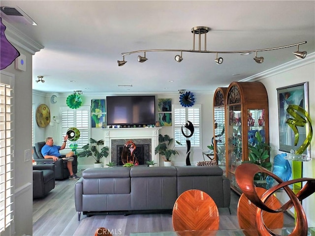 2774 Sawtelle Blvd, Los Angeles, CA 90064 - living room featuring crown molding, a fireplace, and light wood-style floors