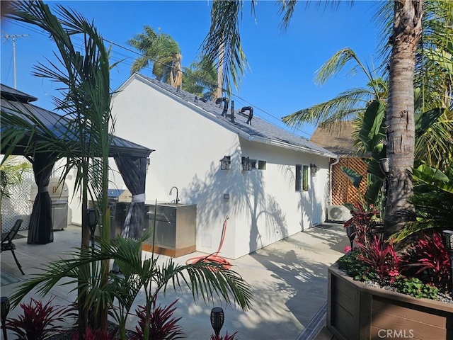 2774 Sawtelle Blvd, Los Angeles, CA 90064 - back of house featuring stucco siding, a gazebo, and a patio