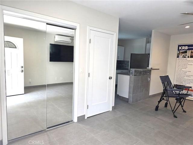 2774 Sawtelle Blvd, Los Angeles, CA 90064 - hallway with an AC wall unit and light tile patterned floors
