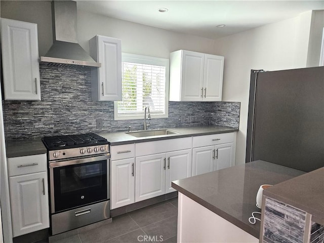 2774 Sawtelle Blvd, Los Angeles, CA 90064 - kitchen with stainless steel appliances, wall chimney exhaust hood, dark tile patterned floors, tasteful backsplash, and recessed lighting
