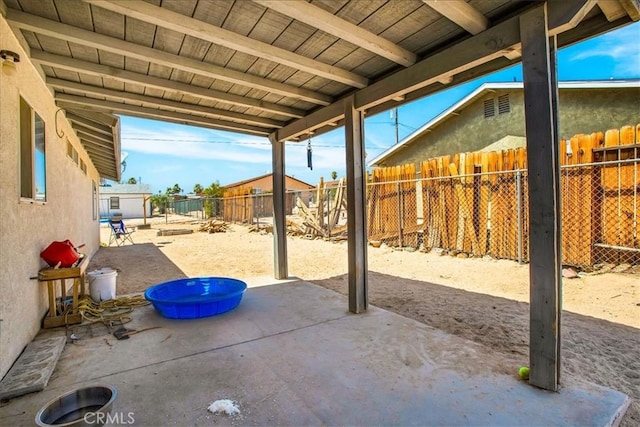 5982 Morongo Rd Unit 29, Palms, CA 92277 - fenced backyard featuring a patio area