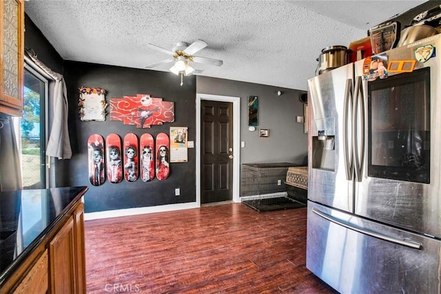 5982 Morongo Rd Unit 29, Palms, CA 92277 - kitchen featuring stainless steel fridge with ice dispenser, a ceiling fan, dark wood-style floors, brown cabinetry, and a textured ceiling