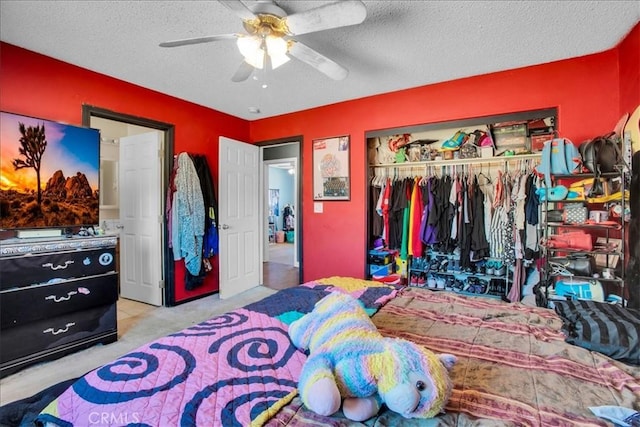 5982 Morongo Rd Unit 29, Palms, CA 92277 - carpeted bedroom featuring a closet, a textured ceiling, and ceiling fan