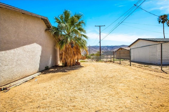 5982 Morongo Rd Unit 29, Palms, CA 92277 - view of yard with a mountain view