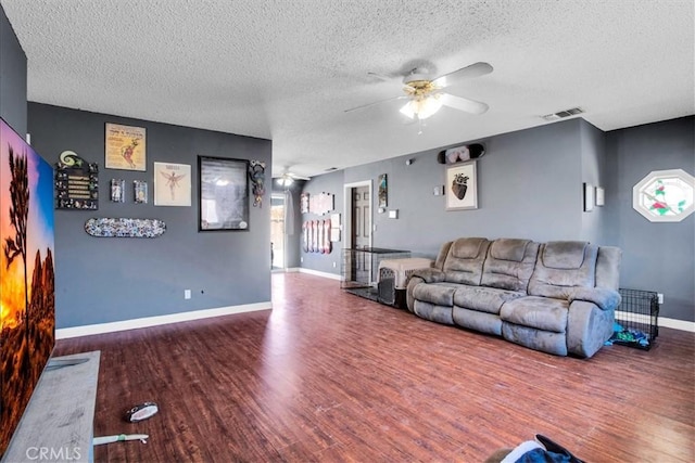 5982 Morongo Rd Unit 29, Palms, CA 92277 - living room with ceiling fan, a textured ceiling, and wood finished floors