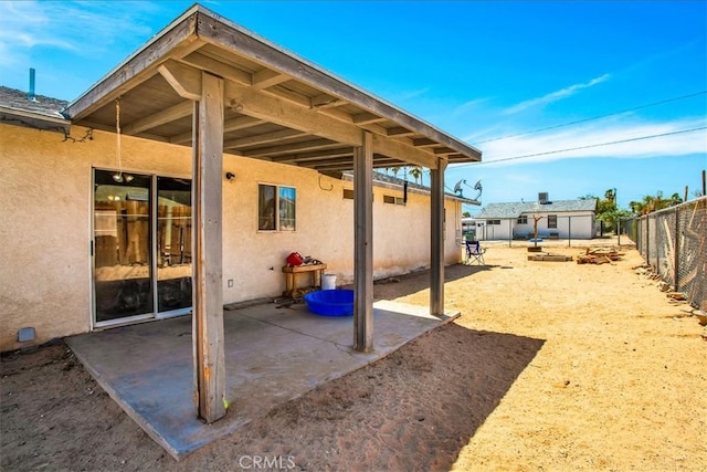 5982 Morongo Rd Unit 29, Palms, CA 92277 - fenced backyard with a patio and an outbuilding