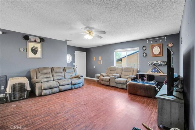 5982 Morongo Rd Unit 29, Palms, CA 92277 - living room with a ceiling fan, a textured ceiling, and wood finished floors