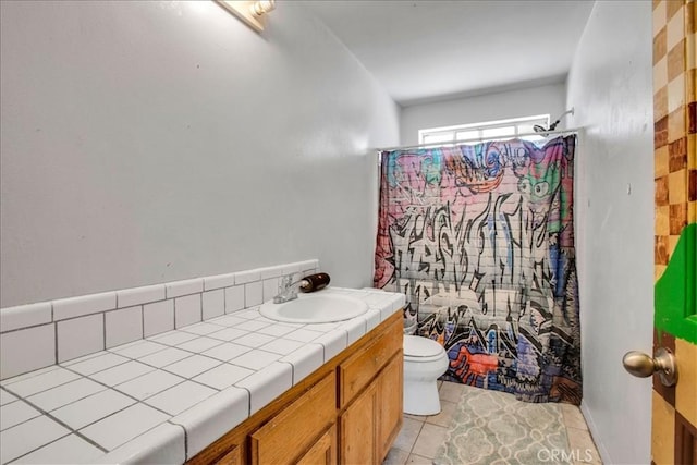 5982 Morongo Rd Unit 29, Palms, CA 92277 - bathroom featuring a shower with shower curtain, vanity, and tile patterned floors