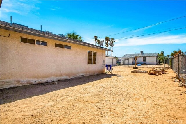 5982 Morongo Rd Unit 29, Palms, CA 92277 - rear view of house featuring stucco siding