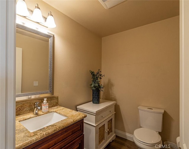 7019 Passons Blvd, Pico Rivera, CA 90660 - half bathroom featuring vanity and wood finished floors