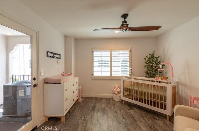 7019 Passons Blvd, Pico Rivera, CA 90660 - bedroom with multiple windows, wood finished floors, a crib, and a ceiling fan