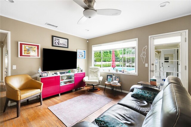 14060 Chandler Blvd, Sherman Oaks, CA 91401 - living area featuring wood finished floors, ceiling fan, and ornamental molding