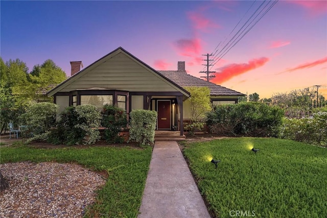 14060 Chandler Blvd, Sherman Oaks, CA 91401 - view of front of property with a chimney and a yard