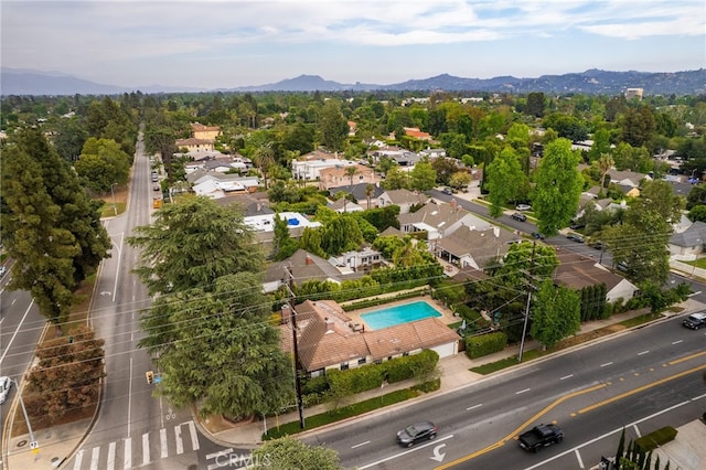 14060 Chandler Blvd, Sherman Oaks, CA 91401 - aerial perspective of suburban area with a pool area and a mountain backdrop