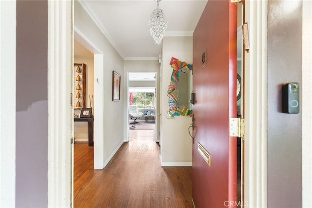 14060 Chandler Blvd, Sherman Oaks, CA 91401 - hall featuring wood finished floors, ornamental molding, and a chandelier