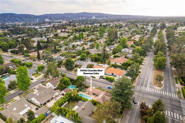 14060 Chandler Blvd, Sherman Oaks, CA 91401 - drone / aerial view of mountains and a pool