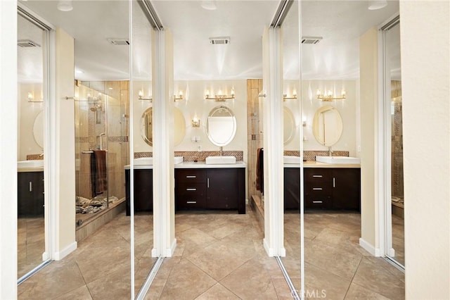 33087 Corte Ganso, Temecula, CA 92592 - full bath with tile patterned flooring, two vanities, and a shower stall