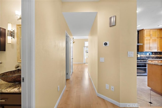 33087 Corte Ganso, Temecula, CA 92592 - hall with a sink and light wood-type flooring