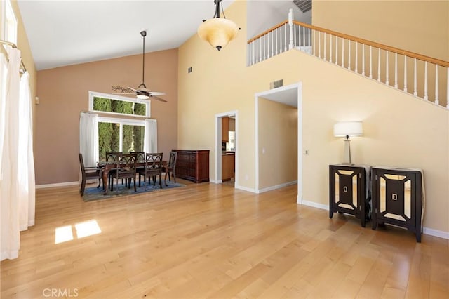 33087 Corte Ganso, Temecula, CA 92592 - dining room featuring a ceiling fan, high vaulted ceiling, and light wood-style flooring
