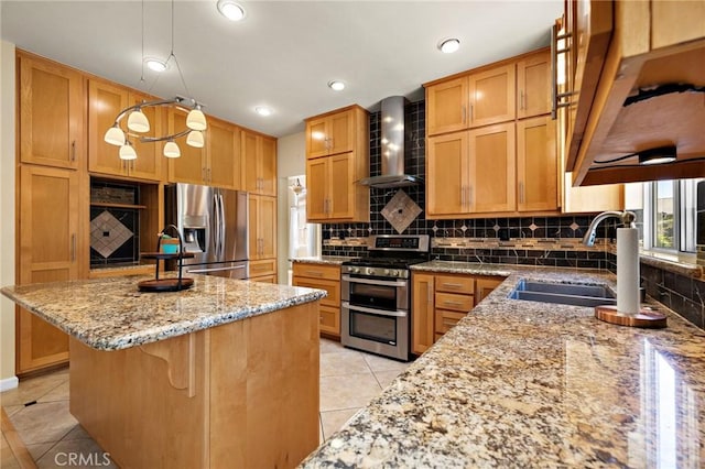 33087 Corte Ganso, Temecula, CA 92592 - kitchen with appliances with stainless steel finishes, wall chimney range hood, light tile patterned floors, backsplash, and a kitchen island
