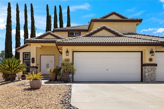 33087 Corte Ganso, Temecula, CA 92592 - view of front of property featuring a garage, driveway, stone siding, and a tile roof