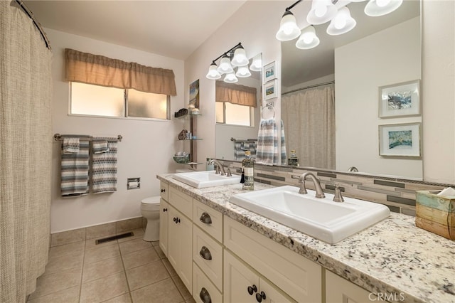 7 Calgary Ln, Chico, CA 95926 - full bath featuring double vanity, tile patterned flooring, decorative backsplash, and a shower with curtain