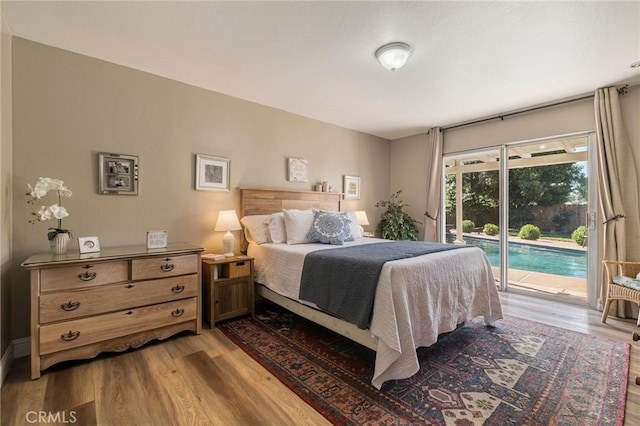 7 Calgary Ln, Chico, CA 95926 - bedroom featuring access to exterior and wood finished floors