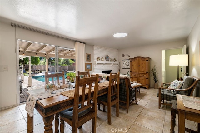 7 Calgary Ln, Chico, CA 95926 - dining room with light tile patterned flooring and a brick fireplace