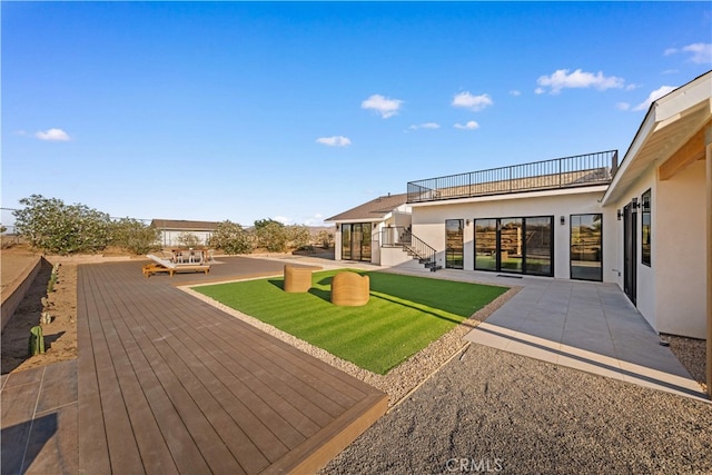 62290 Crestview Dr, Joshua Tree, CA 92252 - wooden terrace with a patio area and a yard