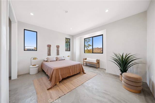 62290 Crestview Dr, Joshua Tree, CA 92252 - bedroom featuring finished concrete floors, multiple windows, and recessed lighting
