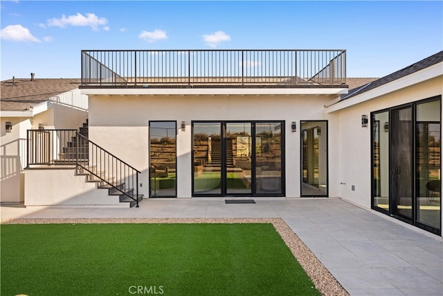 62290 Crestview Dr, Joshua Tree, CA 92252 - back of property featuring stairway, stucco siding, a balcony, and a patio area