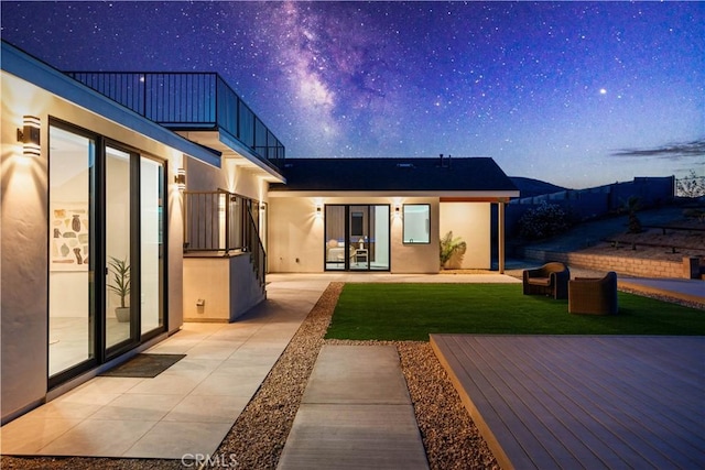 62290 Crestview Dr, Joshua Tree, CA 92252 - rear view of property with stucco siding, a yard, and a balcony